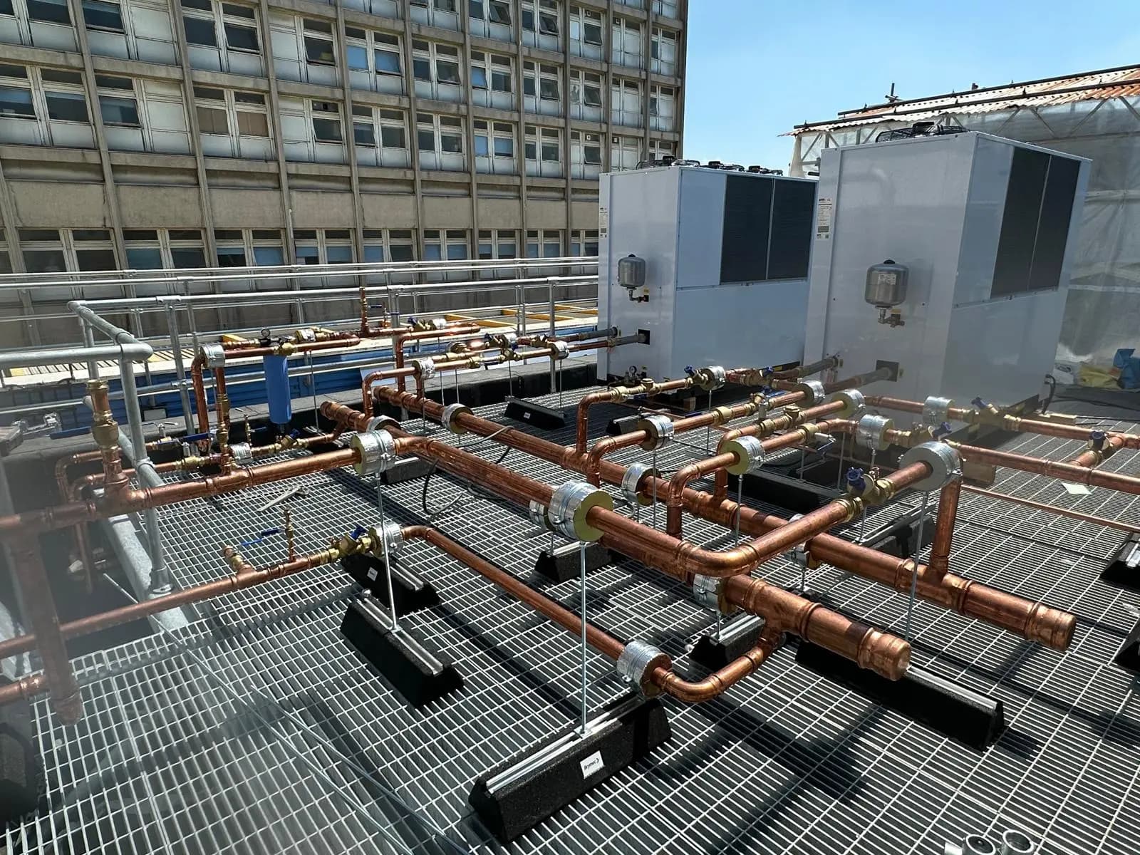 Landing Page Hero Image, showing pipework of a rooftop chiller